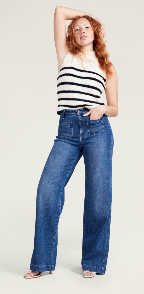 Wide leg blue jean pants paired with a striped top.