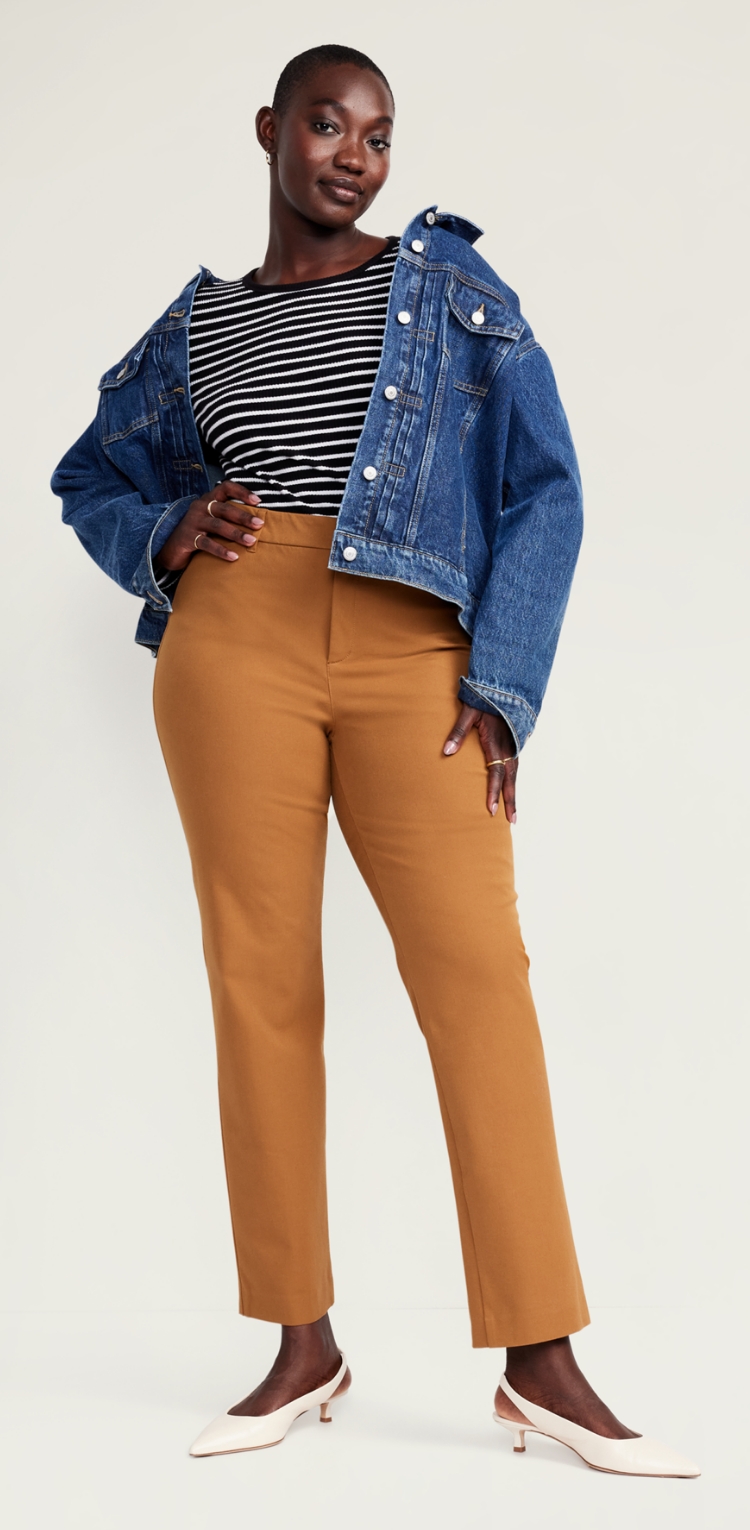 A female model in khaki stretchy slim fit pants.