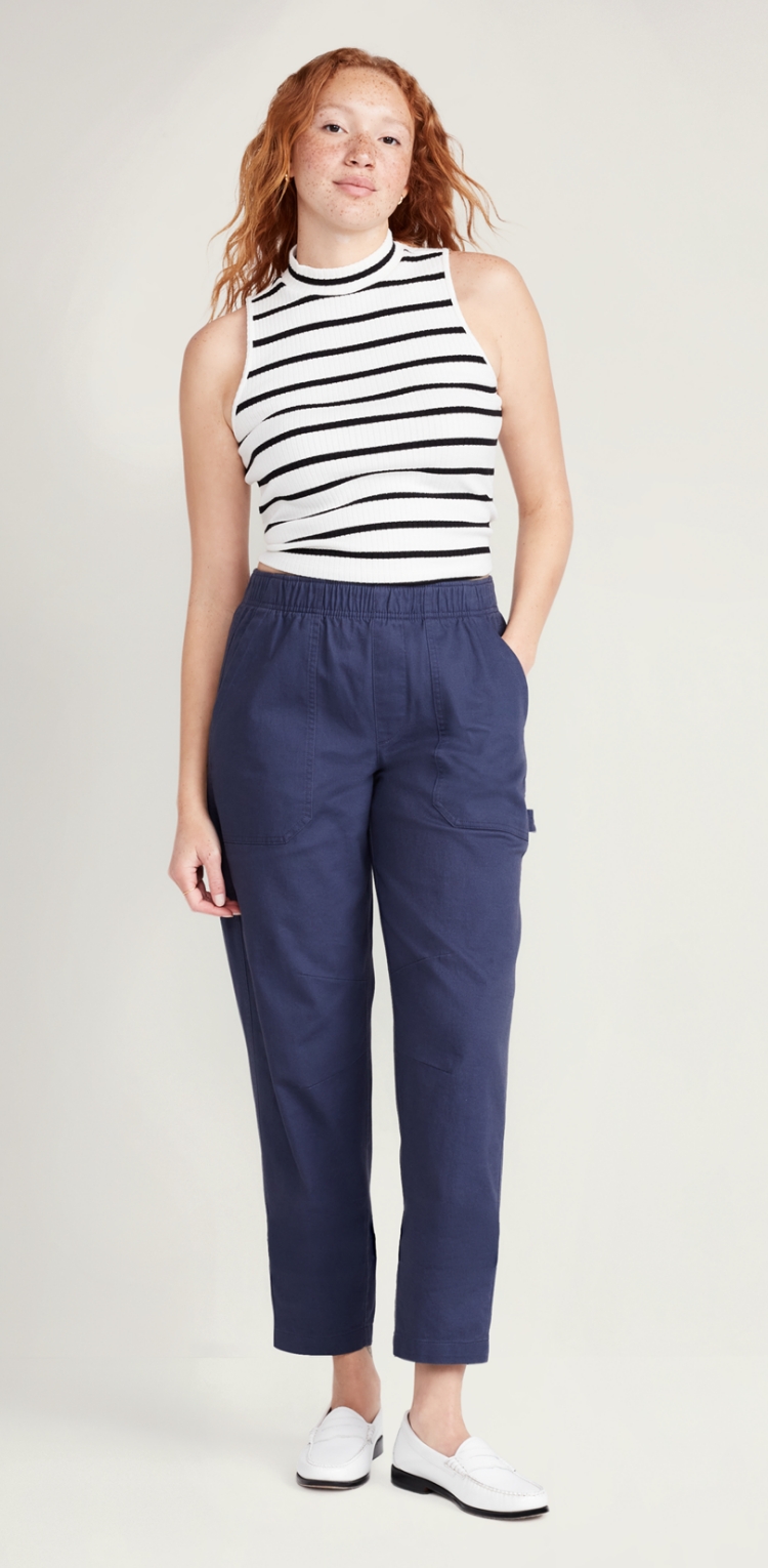 A female model in navy blue utility pants.
