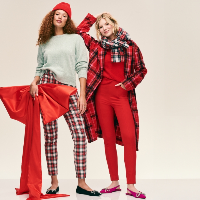 Two female models wearing a variety of holiday plaids