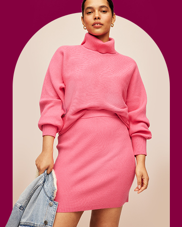 A female model in a pink knit skirt and matching sweater set.