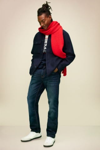 A male model wearing a long sleeve shirt jacket with Old Navy jeans