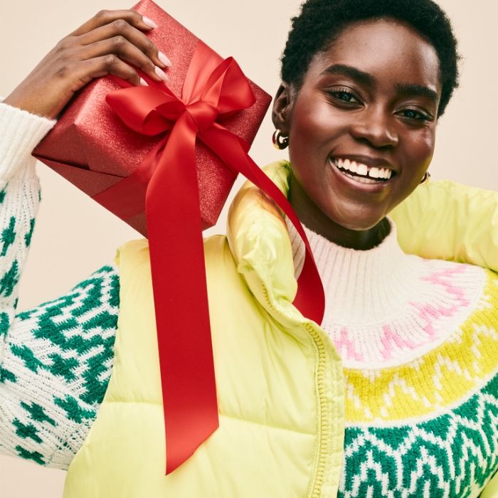 A female model wearing Old Navy Holiday apparel