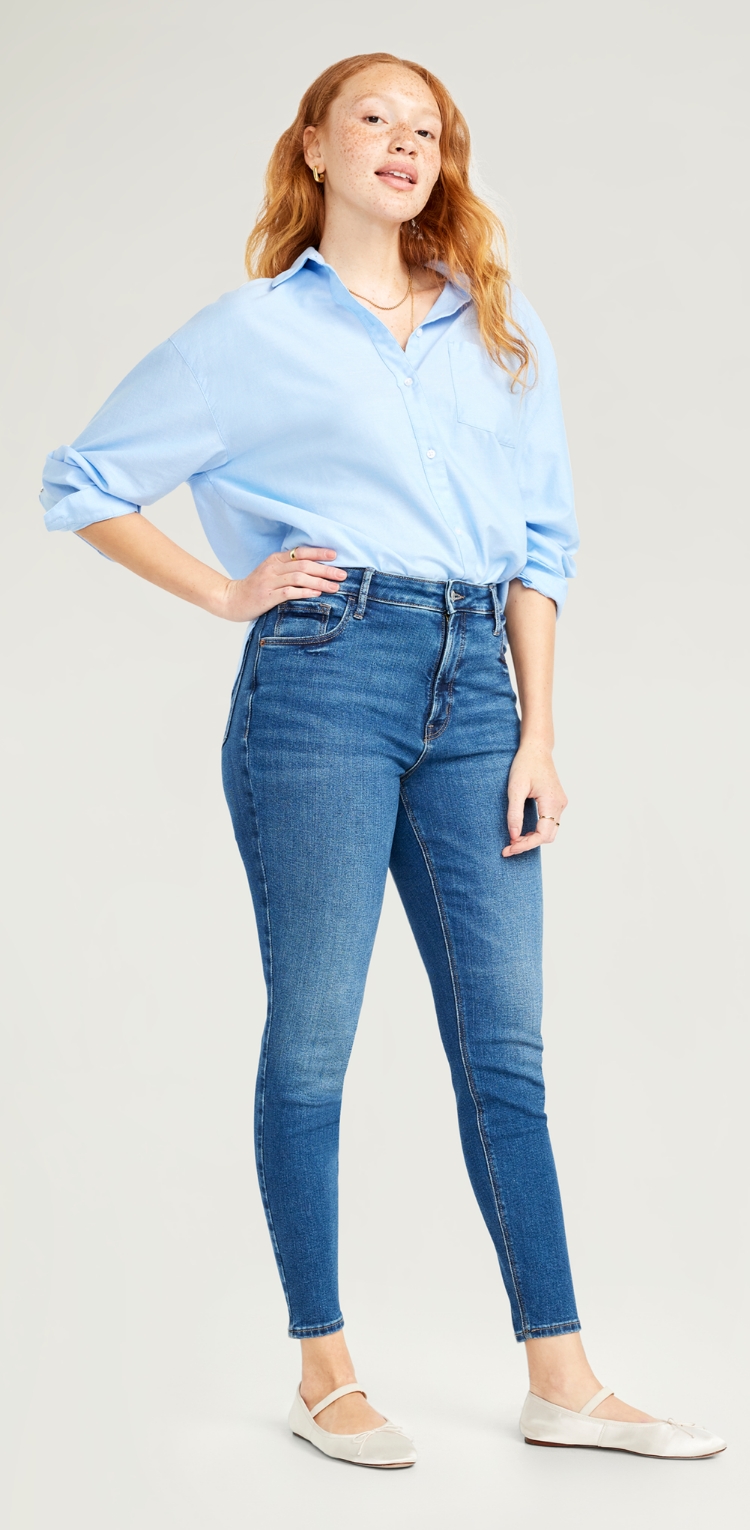 A pair of medium wash jeans in a skinny fit.