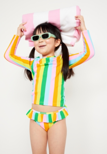 A young girl model wearing multi stripe Ruffle-Trim Bikini Swim Set for Toddler and Baby.