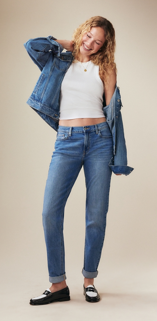 pair of mid-rise medium washed wow boyfriend jeans.