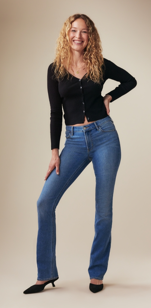 A pair of high waisted medium washed wow boot-cut jeans.
