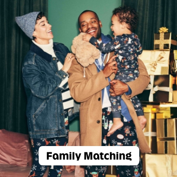 A family in matching let it snow pajamas.