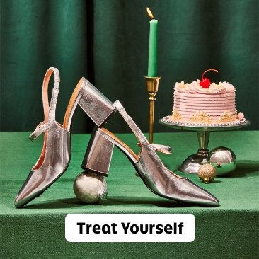 A pair of women's metallic silver block heels.